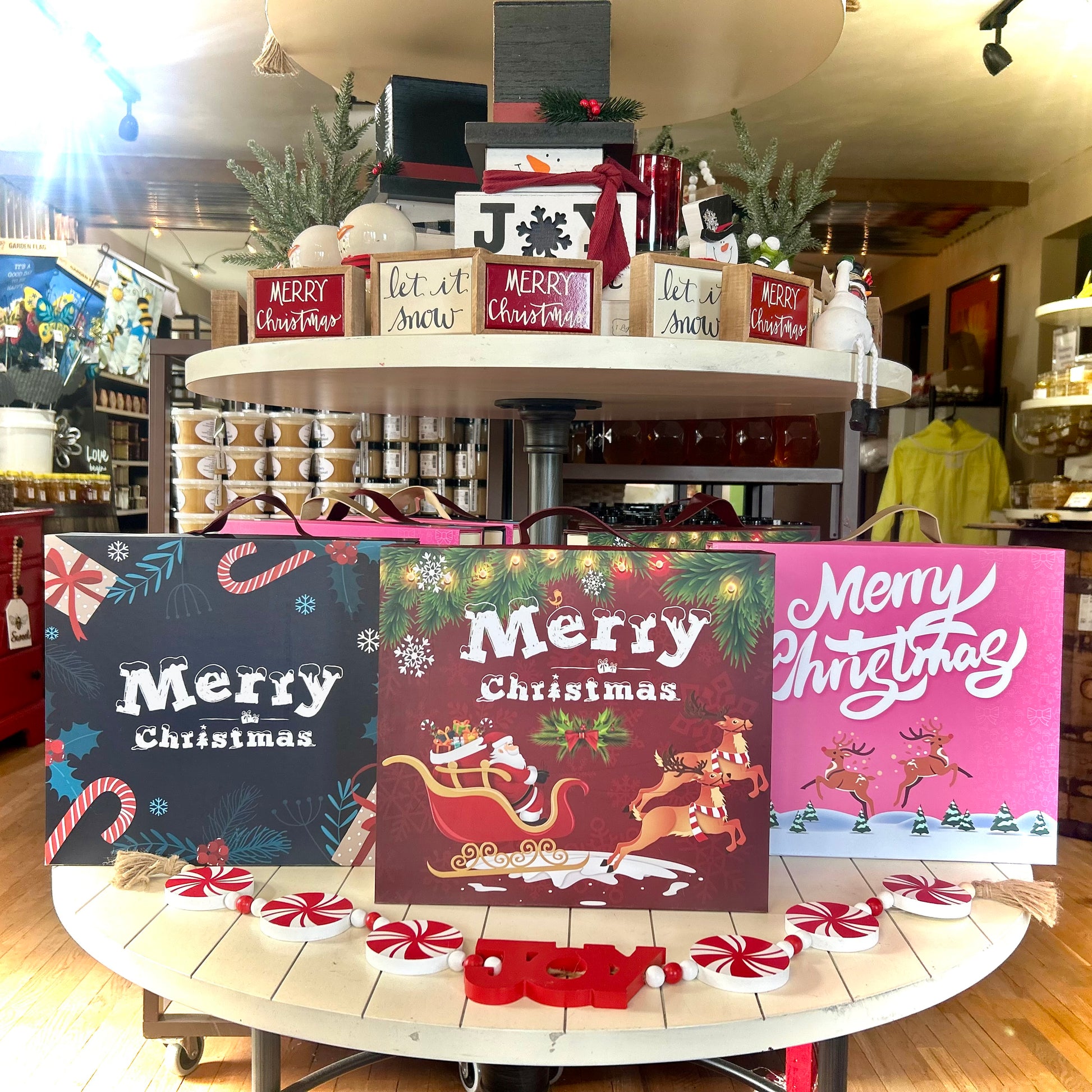 Advent calendar in Bee Great Marketplace display with holiday décor and honey jars.