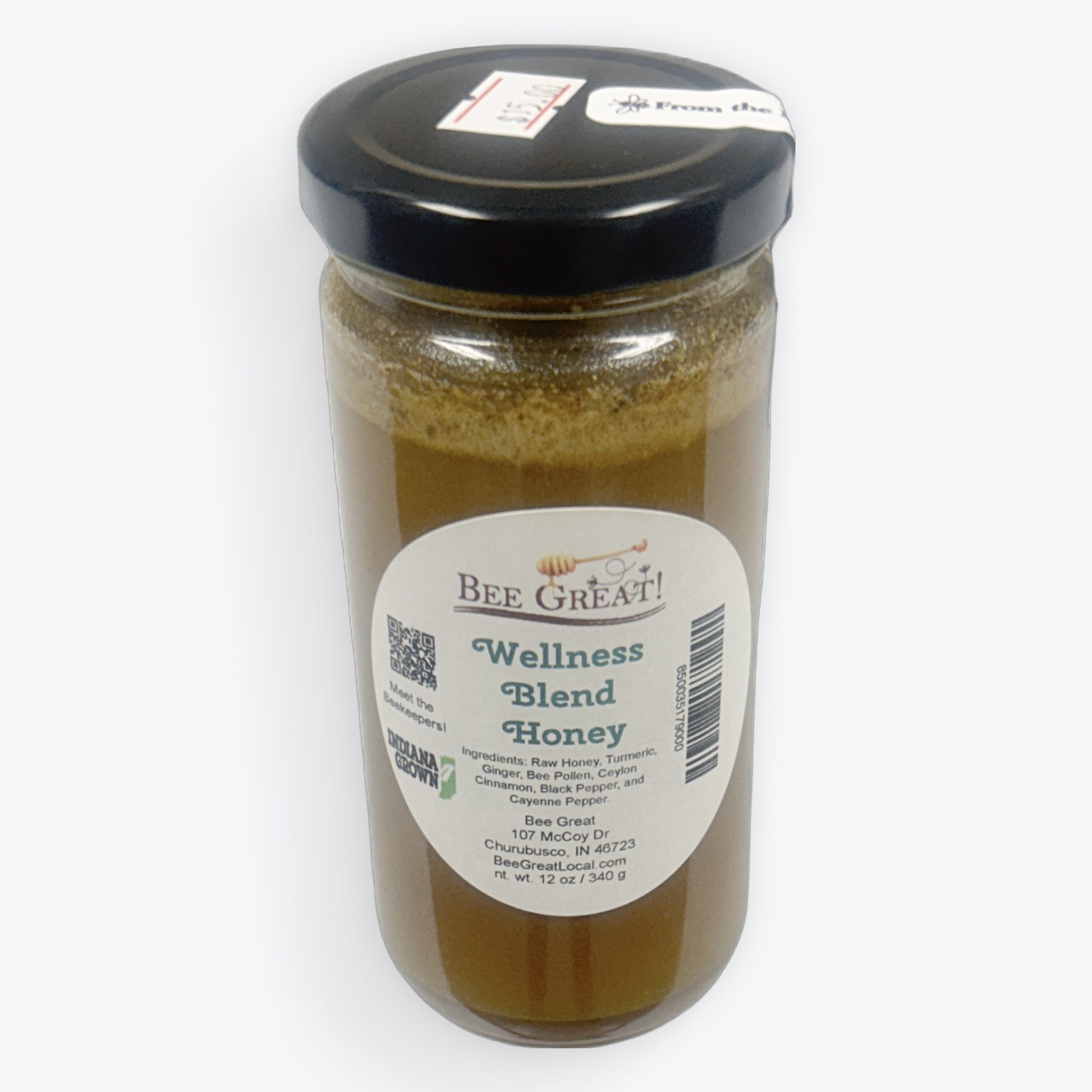 Jar of 'Wellness Blend Honey' with a label on a white background