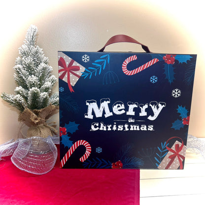 Christmas-themed advent calendar with decorative elements and a small tree on a red surface.