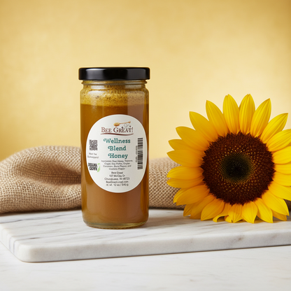 Jar of Bee Great Wellness Blend Honey with a sunflower on a marble surface against a yellow background