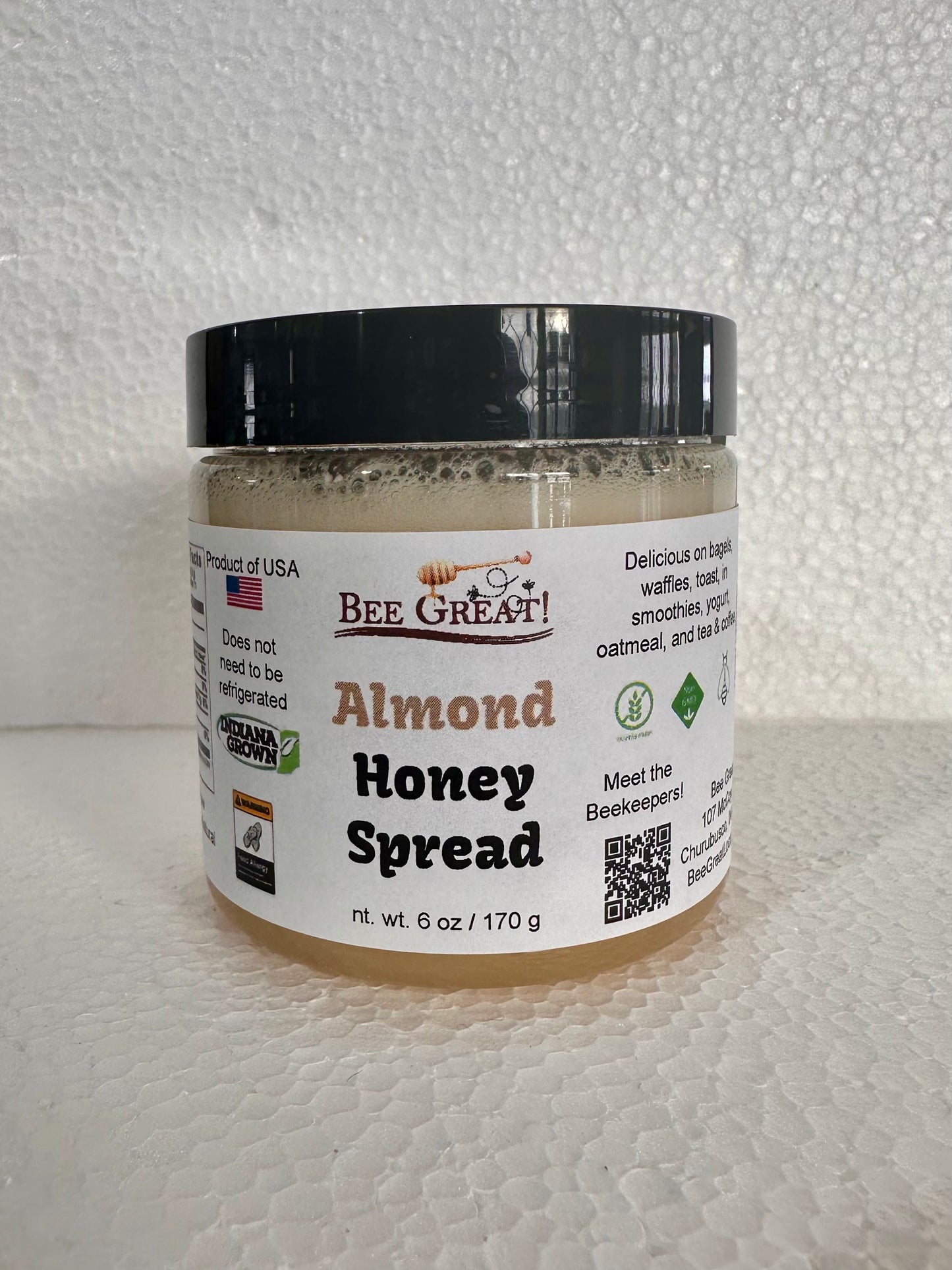 bee great almond honey spread (creamed honey) in a plastic jar with black screw cap