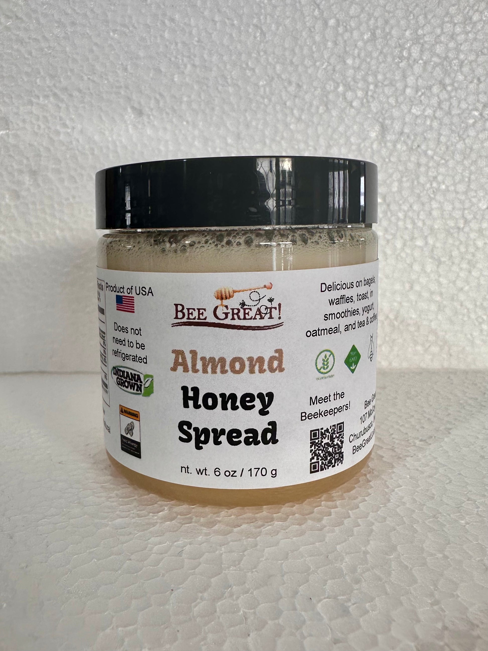 bee great almond honey spread (creamed honey) in a plastic jar with black screw cap
